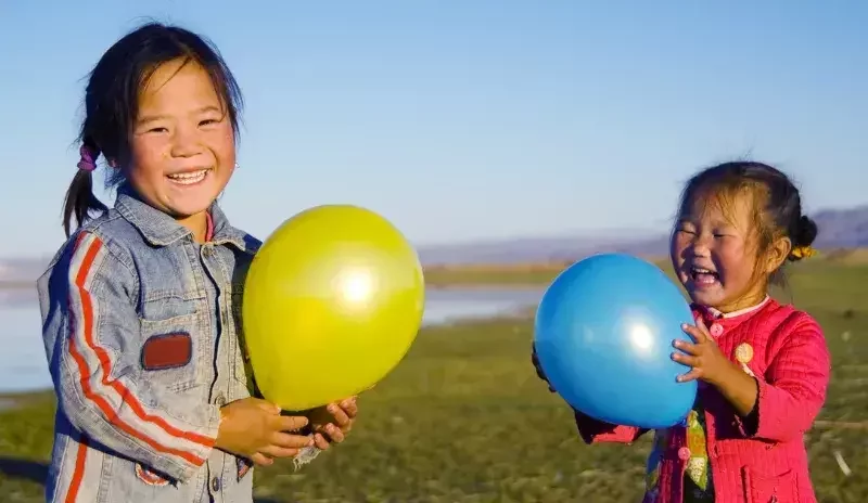 Mongolian children enjoying life on the steppe during The Gobi and Sacred Mountains Expedition adventure tour