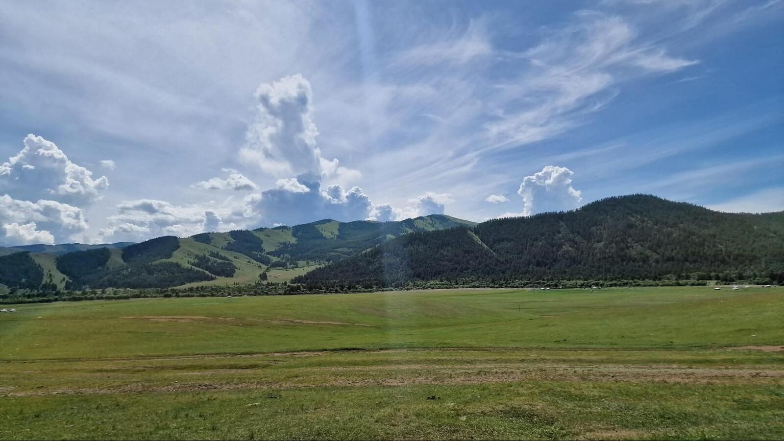 Endless grasslands and open skies of the Mongolian Steppe.