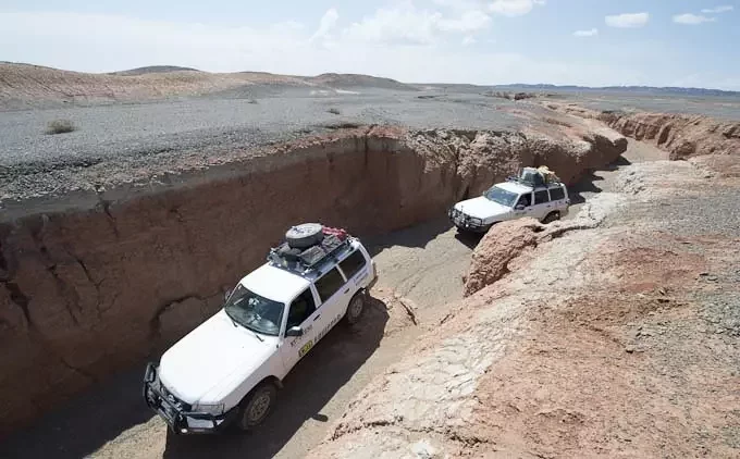 Khanbogd Shar Tsav Geopark off-road tour, Gobi Desert Mongolia adventure travel with 4x4 vehicles exploring remote canyon landscape