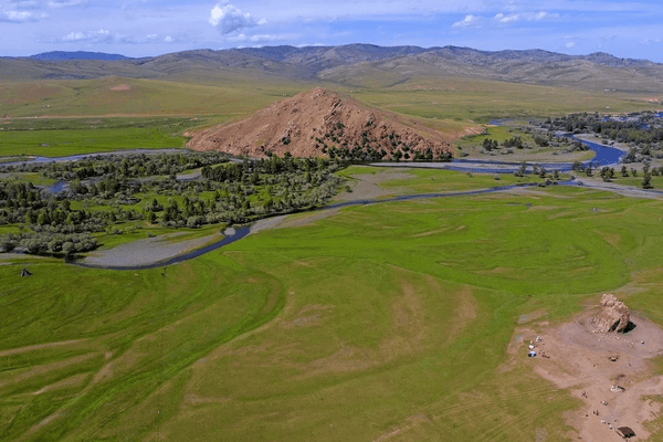 Open steppe landscape in Arkhangai Mongolia with river and green plains