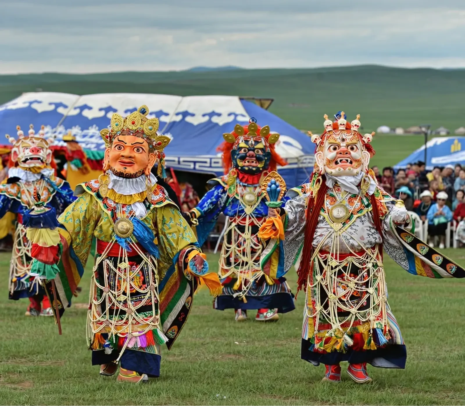 Eagle hunters riding horses across a snowy landscape in Mongolia.
