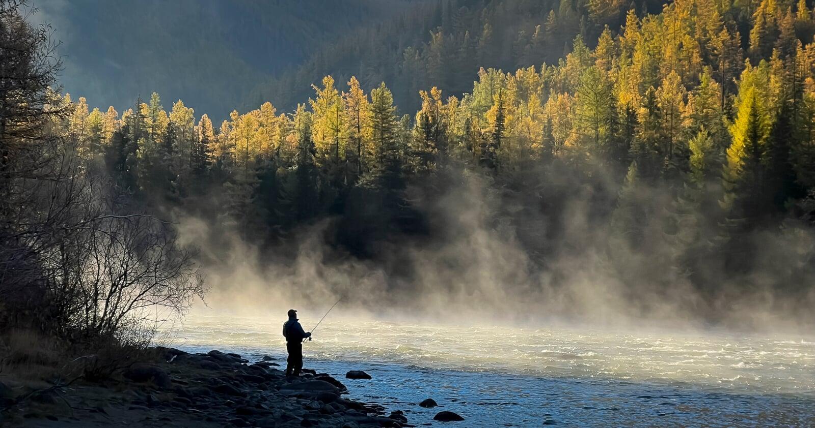 Fishing along the misty Kherlen River in Gun-Galuut Nature Reserve
